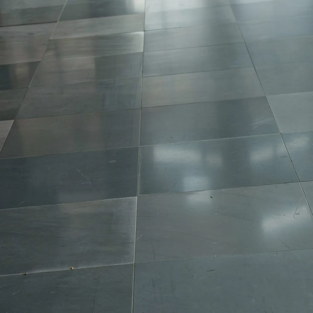 Finished raised access flooring panels installed across a commercial interior floor