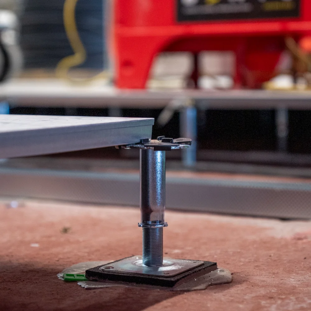 Adjustable raised access flooring pedestal supporting floor panels during installation